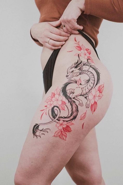 Discover the power and elegance of dragon tattoos. Let Glaminati.com be your guide to finding the perfect ink that speaks to your soul. #glaminati #dragontattoo #dragontattoos #femaledragontattoo #dragontattoodesign #tattooideas Dragon Tattoo Leg, Dragon Thigh Tattoo, Black Dragon Tattoo, Palm Mehndi, Hip Tattoo Designs, Red Dragon Tattoo, Small Dragon Tattoos, Tato Naga, Tato Paha