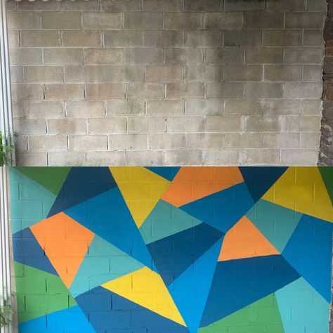 Painted cinderblock wall Cinder Block Accent Wall, Cinder Block Mural, Cinderblock Wall Makeover, Cinder Block Wall Mural, Cinderblock Wall Makeover Backyard, Cinder Block Painting Ideas, Paint Cinder Block Wall Outdoor, Painted Cinderblock Wall Backyard, Backyard Cinder Block Wall Painting Ideas