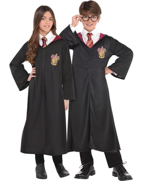 Stroll the halls at Hogwarts with the Kids' Harry Potter Gryffindor Robe, Black One Size. This Harry Potter robe makes you feel like a student going back to the school of witchcraft and wizardry. The Halloween outfit features a black Hogwarts robe with a printed Gryffindor house crest on the front and an attached red-lined hood. Thanks to its front-style closure, the robe is easy to put on and slip off. This Officially licensed Warner Brothers Harry Potter costume is made of 100% polyester and m Harry Potter Kids Costume, Harry Potter Gryffindor Robe, Gryffindor House Crest, Harry Potter Tie, Harry Potter Costumes, Hogwarts Robes, Harry Potter Robes, Harry Potter Halloween Costumes, Gryffindor House