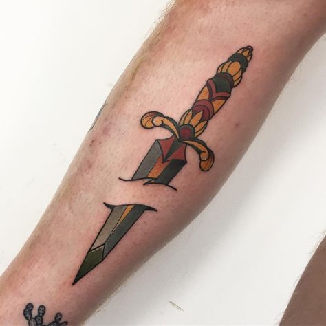 Cool dagger stabbed skin tattoo Dagger Through Skin Tattoo, Dagger Tattoo Meaning, Traditional Tattoo Meanings, Traditional Dagger Tattoo, Traditional Dagger, Rocket Tattoo, Dorm Door, Back Of Arm Tattoo, Skin Tattoo