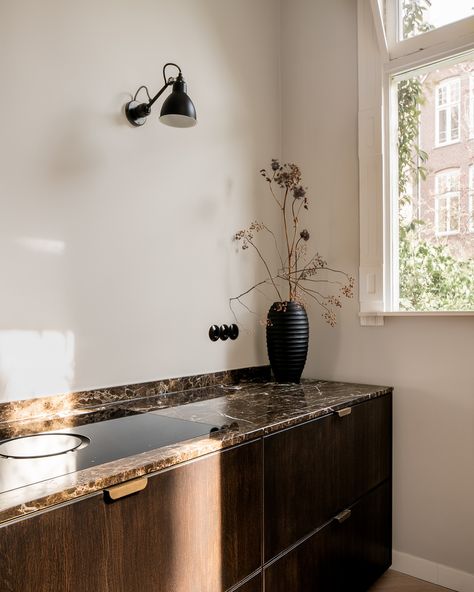 Step into this exquisite kitchen, where dark smoked wooden panels create a warm, inviting atmosphere. The natural stone worktop adds a touch of elegance, while the integrated cupboard with classic cannelures discreetly conceals an oven and offers ample storage space. Welcome to a space where craftsmanship meets timeless beauty. #handcrafted #kitchenelegance #urbankitchen #justusfelthuis #handmadewithlove #woodmeetsmarble Kitchen Stone, Kitchen Dark, Urban Kitchen, Double Vanity, Timeless Beauty, Home Projects, Cupboard, Natural Stone, Entryway Tables