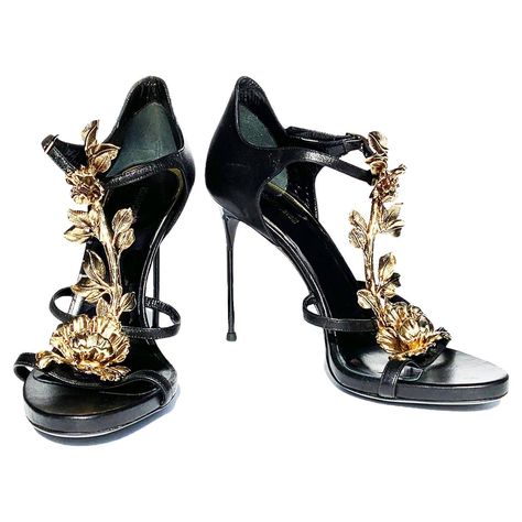 New Roberto Cavalli Metal Flowers Embellished T-Strap Sandals Italian size 38 ( US 8) Black Leather, Unique 3 D Gold - Tone Metal Embellishment, Adjustable Buckle, Stiletto Heel - 4 inches. Made in Italy. New without box. Velvet Thigh High Boots, Vintage Roberto Cavalli, Thigh High Heels, Leather High Heel Boots, Jeweled Shoes, Thigh High Boots Heels, Flower Shoes, Vintage Heels, Boot Jewelry