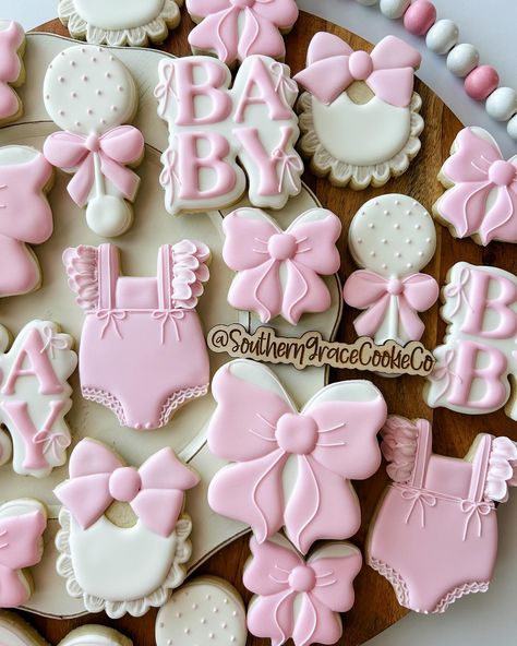 Loveee all the bows, I’ll take all of the girly bow orders please😍🎀 #bowthemebabyshower #babyshowercookies #bowcookies #louisianacookies #decoratedsugarcookies Pink Bow Baby Shower Cookies, Bow Baby Shower Cookies, Pink Bow Theme Baby Shower Ideas, Bow Desserts, Pink Bow Cookies, Baby Shower Bow Theme, Bow Baby Shower Theme Girl, Coquette Baby Shower Theme, Pink Bow Baby Shower Theme