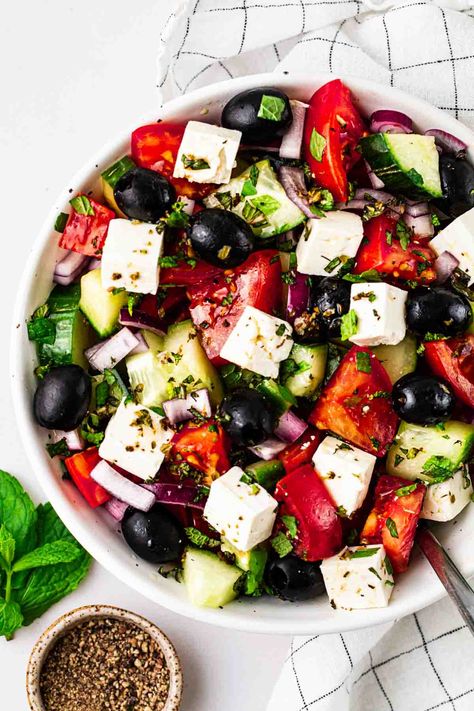 This delicious and simple traditional Greek Salad recipe is the perfect summer side dish. It never goes out of fashion when made well. The perfect reminder of holidays and hot days. So easy to make, it's low carb, gluten free, packed with tasty tomatoes, cucumber, olives, feta cheese and olive oil. #greeksalad #glutenfree #tamingtwins #lunchrecipe #easyrecipe Greek Salad Recipe, Traditional Greek Salad, Summer Sides, Summer Side Dish, Salad Easy, Greek Salad Recipes, Summer Side Dishes, Greek Salad, Hot Days