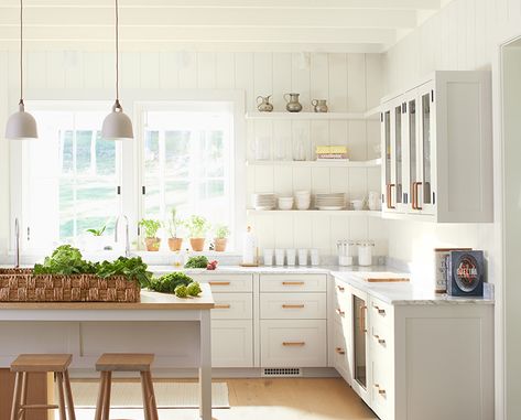 A sun-drenched kitchen with Seasell OC-120-painted white walls includes white cabinets, trim and ceiling. Top Grey Paint Colors, Off White Paint Colors, Kitchen With White Cabinets, Cream Kitchen Cabinets, Rustic Wood Floors, Hallway Closet, Painted Kitchen Cabinets Colors, Best White Paint, Cabinet Paint Colors