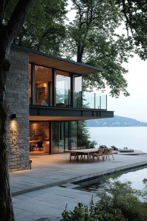 Lakeside house indoor outdoor living. Discover sleek and stylish concepts for modern lakeside homes that fuse natural beauty with contemporary living. House With Nice View, Beach Homes Exterior Seaside Coastal, Modern Waterfront Homes, Glass Lake House, Modern Lake House Exterior, Lake House Modern, Modern Lakehouse, Contemporary Lake House, Lakeside House