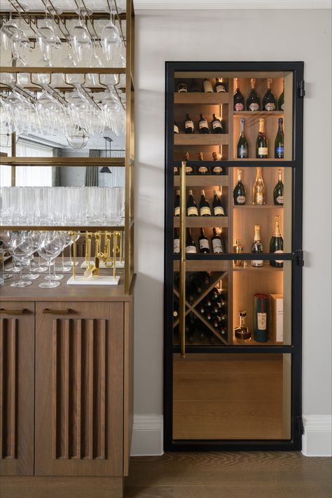 Captivating wine room with elegant crittall glass doors, softly illuminated ambiance, and a glimpse of our custom-built bar featuring suspended glass storage and subtle undercounter fridge drawers. 🍷🍇 #WineRoomGoals #HomeBar InteriorDesign #wineroom #winecellar #barinspo #homebar #entertainmentroom #winestorage #crittalldoor Built In Display Cabinet Glass Doors, Built In Bar Cabinet, Undercounter Fridge, Glass Fridge, Glass Cupboard, Cabinet Glass Doors, Fridge Drawers, White Cupboards, Bar Unit