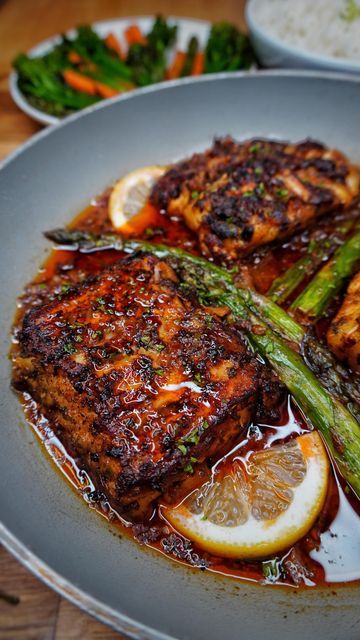 Kay on Instagram: "CAJUN WHITE FISH & ASPARAGUS IN A SPICY GARLIC BUTTER SAUCE, WHITE RICE AND VEG💣💥🔥🚀🏆💯🌋🎉🧨. The tastiest, quick and easy Cod filets, that are rubbed with an amazing spice mixture before grilling to perfection. Then cooked in the most IRRESISTIBLE spicy garlic butter sauce with Asparagus. All comes together in 25 MINUTES. In the recipe I also show the trick to keep the fish together. THE BEST FISH RECIPE TO DATE!!! NO JOKE!! 💯🥳🤤. . . DM FOR MORE INFO TO GET MY DAILY R Spicy White Fish Recipes, Hot Honey White Fish In A Garlic Herb Butter Sauce, Cajun Cod Recipes, Fish Ideas For Dinner, Whiting Fish Recipes, Spicy Garlic Butter Sauce, Lunch Nyc, Cajun Fish Recipes, Cajun Fish