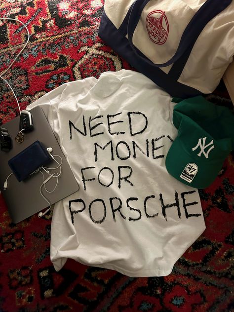 need money for porsche white t-shirt forest green baseball cap ny yankees blue Louis Vuitton wallet trader joes bag apple MacBook earbuds rug aesthetic Porsche Shirt, Need Money For Porsche, Need Money, Classic White, Fitness Inspo, Graphic Shirts, Mood Pics, Dream Cars, Clothing Brand