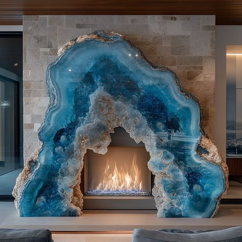 A geode fireplace is a stunning centerpiece that blends the natural beauty of geology with the warmth and comfort of a modern hearth. Crafted to mimic the intricate formations found inside geodes, the fireplace features a crystalline interior that shimmers with vibrant hues when illuminated by the flickering flames. The exterior is rugged and textured, resembling the raw outer shell of a geode, while the inside reveals a dazzling array of crystals, offering a captivating contrast. Perfect for... Geode Fireplace, Modern Hearth, Giant Crystal, Geode Decor, Blue Geode, Crystal Design, Carpentry, Geology, Natural Beauty