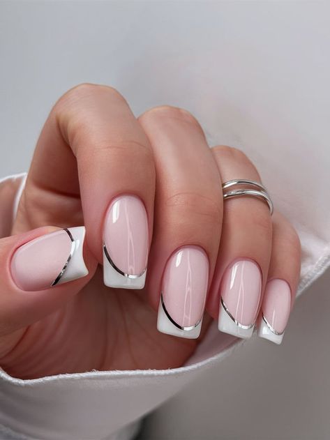 A modern twist on the French manicure, these nails feature a milky white base with sleek silver tips. The combination of glossy polish and metallic accents creates a clean yet striking look for 2025. Classy Coffin Nail Designs, Nail Designs Silver, Silver French Tip, Nails 2025, Coffin Nail Designs, Silver Tips, Milky Nails, Coffin Nails Designs, Milky White