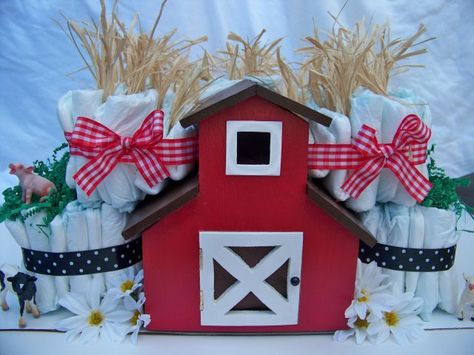 This was a custom made diaper cake for a couple who was having their first baby while living on a farm. There were over 100 diapers in this cake as well as some adorable farm animals toys, and of course, the centerpiece of it all, a handmade, wooden barn with a hinged roof and cut out windows. Inside the barn were a number of baby items including an outfit, receiving blankets and baby booties. I also included a baby calendar to help mommy document that very important first year. Retail was $120 Best Baby Clothes Brands, Creative Baby Gifts, Living On A Farm, Baby Bottle Storage, Country Baby Boy, Trendy Baby Onesies, Trendy Baby Gifts, Farm Animal Toys, Baby Clothes Brands