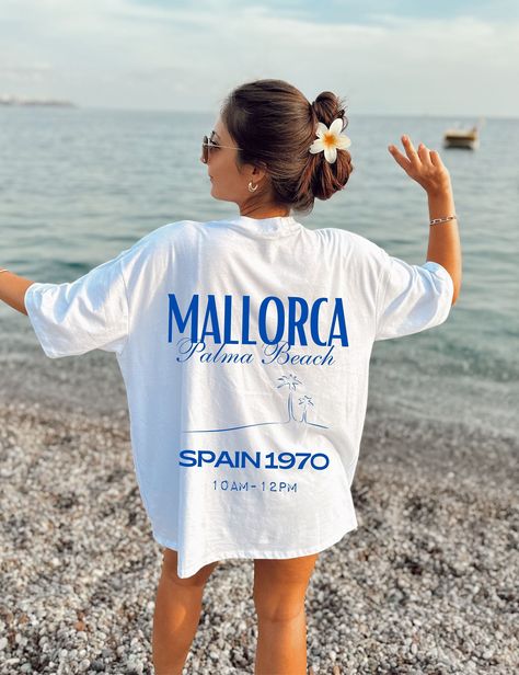 A Mallorca T-shirt is a must-have for all Mallorca lovers and travellers. Show your love for the island with this stylish tee. #Mallorca #Travel #Spain / #Best_Merch_Design #Oversized_Fits_Aesthetic #Oversized_Tshirt_Photoshoot #Tshirts_Design_Ideas Tshirt Photoshoot, Palma Beach, Mallorca Travel, Streetwear Tshirt Design, Tshirts Design, Merch Design, Travel Spain, Fits Aesthetic, Custom Tshirt Design