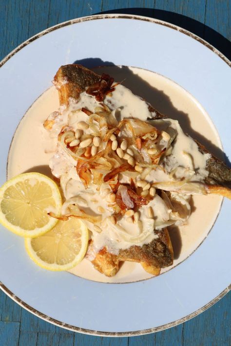 Fish in tahini by Zaatar and Zaytoun - Lebanese Recipes Fish With Tahini Sauce, Lebanese Fish Recipes, Tahini Fish, Mediterranean Fish Recipes, Taramasalata Recipe, Zatar Recipes, Tilapia Dishes, Tahini Recipes, Lebanese Dishes