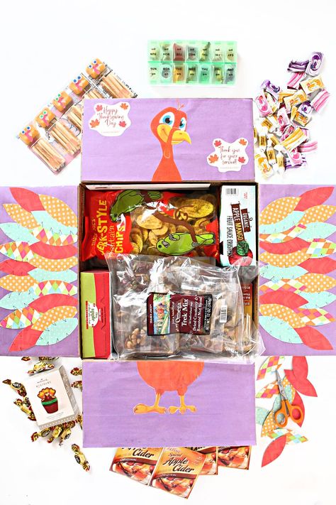 A thoughtful Thanksgiving Care Package filled treats to bring smiles and homey feelings to anyone spending the holidays away from home. Delicious treats and fun crafts make this fall box special! Thanksgiving Table Place Settings, Thanksgiving Care Package, Halloween Care Packages, Care Package Ideas, Fruit Sauce, Spiced Apple Cider, Package Ideas, Thanksgiving Treats, Thanksgiving Greetings