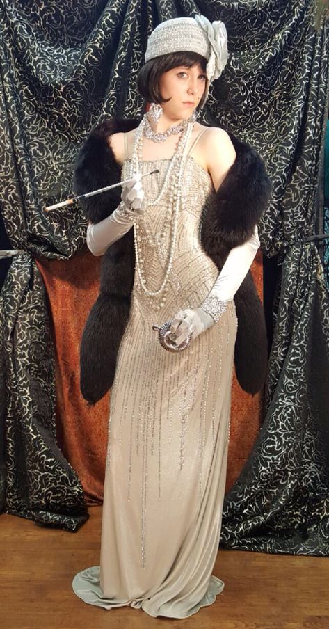 You will find any imaginable 1920’s Outfits for Theme Parties, Gala Fund Raisers, Film or Theatrical Productions. There is a huge selection of 1920’s Outfits for Lavish, Elaborate Celebrity Status Customers or for more economical costumes and accessories. Set your own budget. However, if you want 1920’s Outfits with the ‘Wow!’ factor, that is our specialty. 1920 Fashion Women, Great Gatsby Party Outfit Women, Styled Wigs, Gala Attire, Gatsby Gala, Flapper Wedding, Gatsby Costume, Gala Gowns, Great Gatsby Fashion