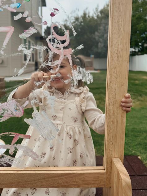 Our 4 in 1 table Easel has 4 functions. It contains a white board and a chalkboard which is magnetic. And last the acrylic insert for which you can use water-based paints on. This table easel is made from Australian timber. This easel therefore gives you plenty of options for your children to express themselves creatively in different ways from using paints to chalk or even magnets Why an easel? As painter and arts educator Kate Mangold explains, "The point of an easel is to get a child standing up and moving their marks," i.e., the squiggles, lines, and dots they make with whatever drawing instrument or paint they're using--and "to engage large motor skills like shoulder rotation and core strength." Using an easel can help kids develop hand-eye coordination and "expressive language, as we Plexiglass Easel, Art Nook, Kids Art Easel, Painting Easel, Table Easel, Drawing Instruments, Messy Kids, Kids Garden, Expressive Language