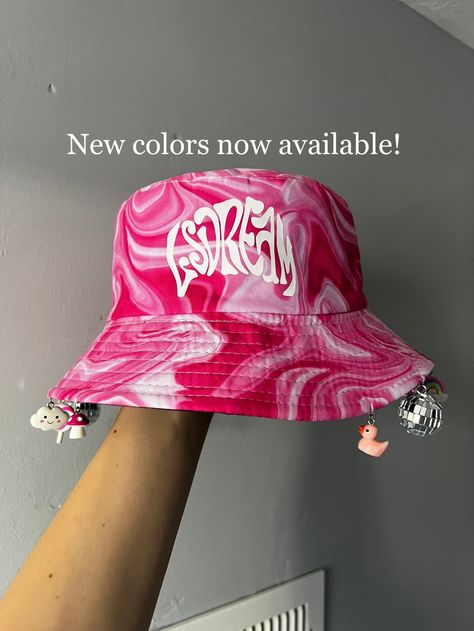 Prepare to get tons of compliments in this hat! This pink trippy Lsdream bucket hat has charms attached all the way around except for in the front so your vision isn't impaired. Now available in more colors! Please message me if you have any questions!