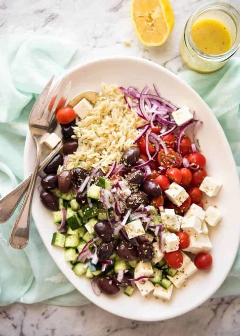 Greek Lemon Orzo Salad | Recipe Tin Eats ~ Orzo, tomatoes, cucumbers, olives, bell pepper, red onion, oregano, & feta. Lemon vinaigrette: Dressing: 2 tsp lemon zest, 3 Tbsp lemon juice, 5 Tbsp EVOO, 1 tsp Dijon mustard, 1 clove minced garlic, 1 tsp sugar, ½ tsp salt, black pepper to taste. Includes links to yogurt marinated chicken & souvlaki. #pasta Greek Lemon Orzo, Orzo Salat, Fourth Of July Recipes, Tin Eats, Lemon Orzo Salad, Greek Orzo, 4th Of July Recipes, Lemon Orzo, How To Cook Orzo