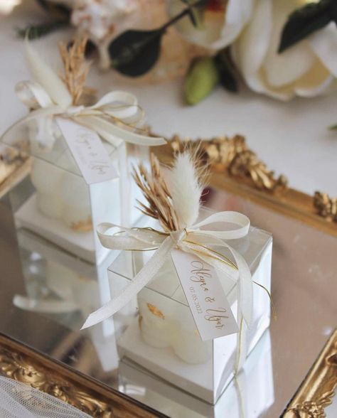 N&H on Instagram: “Introducing our favors as candles. A beautiful bubble candle (color of your choice) with a hint of gold leaf wrapped in a beautiful pvc…” Bubble Mum, Bubble Candle, Wedding Arch Flowers, Candle Wrap, Arch Flowers, Candle Wedding Favors, Wedding 2025, Wedding Gifts For Guests, Wedding Favor Bags