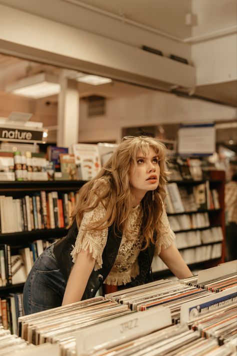 Blond Girl in a record store wearing leather vest and sunglasses 1970s vibes Karen Sirko, Vintage Senior Pictures, Creative Senior Pictures, Senior Photoshoot Poses, Unique Senior Pictures, Senior Photo Poses, Vintage Photoshoot, Creative Photoshoot Ideas, Photographie Portrait Inspiration