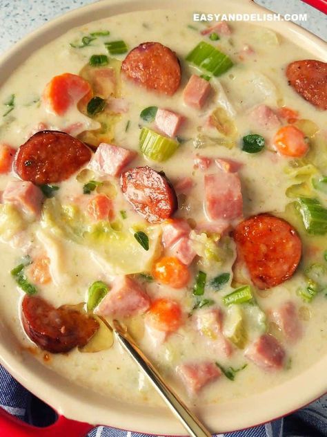 This Creamy Ham and Cabbage Soup recipe is a low-cost keto meal, ideal for chilly days. Cook it on the stovetop, Instant Pot, or Crockpot. It's also gluten-free and healthy. #glutenfreemeals #ketomeals #foodanddrink #foodrecipes #souprecipe #dinnerrecipes #crockpotrecipes #instantpotrecipes Ham Soup Low Carb, Ham Soup Keto, Creamy Cabbage Soup With Ham, Keto Ham And Cauliflower Soup, Keto Ham Soup, Keto Crockpot Cabbage Soup, Cabbage Soup Crockpot, Ham And Cabbage Soup, Honey Baked Ham Recipe