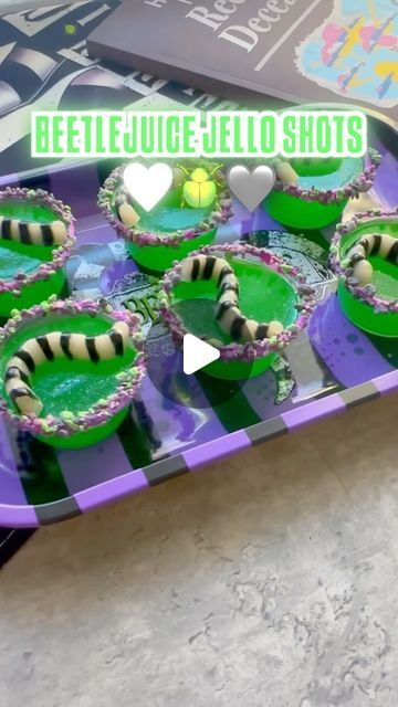 Johany Torres on Instagram: "🪲Beetlejuice Jello Shots🪲

I mean what’s a Halloween party without Jello shots right?  If you want this recipe type “Beetlejuice” 

🪲Worm mold & Green Apple @sonicdrivein gelatin from @walmart 
🪲Halloween Yum Crumbs from @michaelsstores @officialyumcrumbs 
🪲Beetlejuice drink tray @spirithalloween 

#spookycute #halloweenbaking #jelloshots #halloweenpartyideas #jelloshot #gelatina #halloweenfood #halloweenjelloshots #beetlejuice2 #beetlejuicebeetlejuicebeetlejuice #beetlejuicebeetlejuice" Shrek Jello Shots, Beetle Juice Jello Shots, Halloween Jello Molds, Beetlejuice Jello Shots, Beetlejuice Birthday Party Food, Halloween Party Jello Shots, Beetlejuice Drink Recipe, Jello Brain Mold Recipe, Beetlejuice Food Ideas