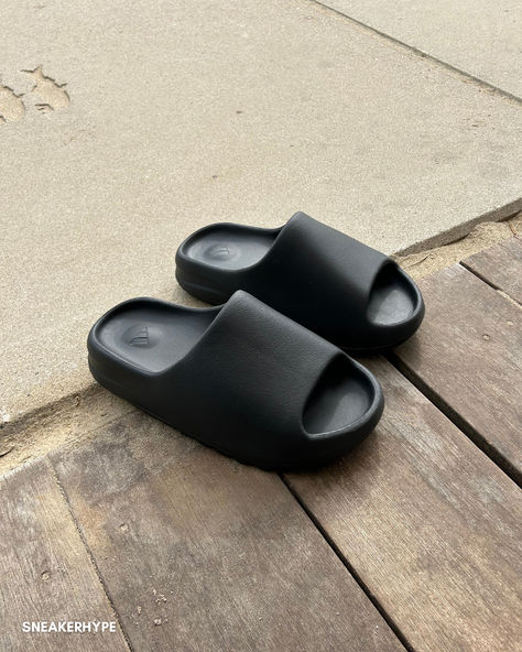 Elevate your summer with Yeezy Slide Onyx – the ultimate comfort piece for your wardrobe. Designed with a sleek all-black foam, they provide exceptional comfort and stability, making them perfect for any summer adventure. These slides are not just comfortable; they're a style statement, blending seamlessly with every outfit, from beachwear to a casual day out. Pair them with denim and a blazer for a chic, effortless look. Make the Yeezy Slide Onyx your go-to summer essential. Foam Yeezy Outfit, Yeezy Outfit, Yeezy Slides, Summer Essential, Summer Adventures, Style Statement, Summer Essentials, All Black, Blending