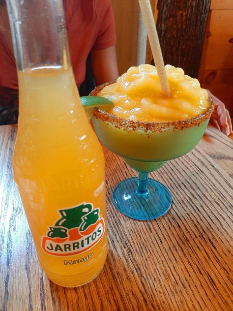 Mango jaritos drink imported from Mexico and a Mango flavored margarita 🍹 At El Mariachi Tacos & Churros restaurant Margarita Restaurant, Mango Drinks, Tacos, Mango, Restaurant, Drinks, Tableware, Glass, Mexico