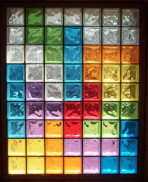 I did stained glass on our front door, but this is just sheets of cellophane which would be easier and less permanent. Coloured Glass Bricks, Colored Glass Bricks, Stained Glass Blocks, Color Glass Wall, Glass Bricks Ideas, Coloured Glass Window, Glass Brick Wall, Brick Window, الجدول الدوري