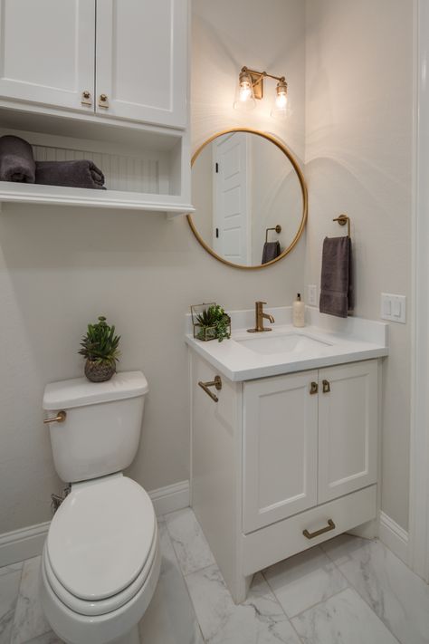 Restroom With Gold Fixtures, Small Bathroom Gold Hardware, White Gold Restroom, All White And Gold Bathroom, Gold Theme Bathroom Ideas, Bathroom White Cabinets Gold Hardware, Small Bathroom Ideas With Gold Fixtures, White And Gold Half Bath, Gold And White Small Bathroom