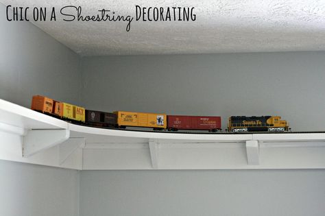 DIY HO Train track shelf around room ceiling by Chic on a Shoestring Decorating Track Shelf, Train Bedroom, Train Room, Budget Friendly Decor, Room Ceiling, Rooms Reveal, Toy Rooms, Boy Bedroom, Big Boy Room