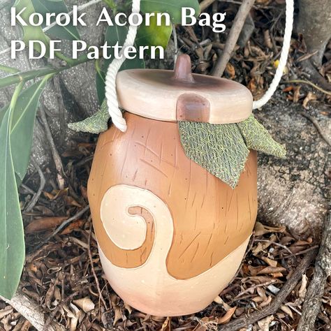 Make the cutest cosplay accessory (or everyday tote if you're whimsical like that) with this korok acorn bag PDF pattern! Perfect for holding all your convention necessities with room to carry all your korok seeds as well! Pattern for EVA foam build. This acorn can be seen in-game in the Korok Forest as well as scattered through Hyrule, where a korok is waiting to be found! Korok Cosplay, Winter Hat Sewing Pattern, Korok Forest, Korok Seed, Acorn Bag, Diy Kandi Bracelets, Zelda Cosplay, Paper Mache Clay, Hallowen Costume