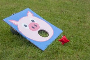 Feed the pig Feed The Pig Bean Bag Toss, Barnyard Games, Barnyard Vbs, Hoedown Party, Farm Animal Party, Peppa Pig Birthday Party, Pig Games, Cowgirl Birthday Party, Barnyard Party