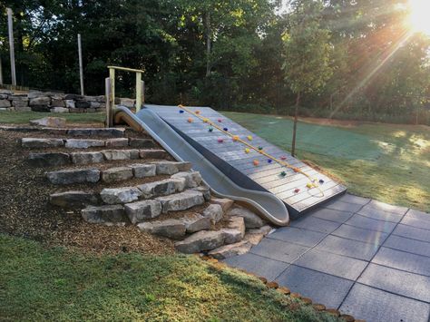 Play Area On Hill, Slide Built Into Hill, Downhill Backyard Ideas, Playground Built Into Hill, Hill Playground Ideas, Playground On A Hill, Playset On Sloped Yard, Playground On Sloped Yard, Sloped Backyard Playground