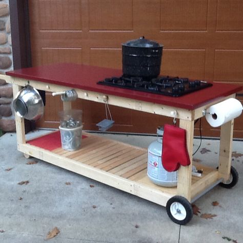 Canning bench made from an old door with a propane cooktop! Propane Cooktop, Canning Kitchen, Workspace Storage, Wooden Cart, Canning Food Preservation, Canned Food Storage, Canning Tips, Home Canning, Summer Kitchen