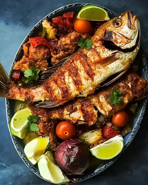 This Jamaican Fried Snapper recipe is a celebration of bold, tropical flavors and crispy textures. The fish is marinated in lime and spices, then fried to perfection for a crispy exterior and moist, flaky interior. Topped with a vibrant sauté of bell peppers, onions, and Scotch bonnet pepper, this dish bursts with spice and flavor that will transport you straight to the Caribbean. Fried Snapper, Snapper Recipes, Jamaican Cuisine, Scotch Bonnet Pepper, Caribbean Cuisine, Rice And Peas, Scotch Bonnet, Food Stands, Sauteed Vegetables