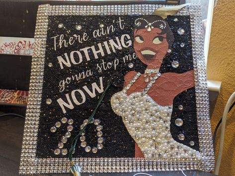 This was my daughter's high school graduation Cap. I started out with a green cap with tassle. I printed Princess Tiana & added words. Then beaded the life into it! Im Almost There Tiana Graduation Cap, Tiana Graduation Cap Ideas, Graduation Cap Designs Silver, Cap Decorations Ideas, Princess Tiana Graduation Cap Designs, Tiana Cap Decoration, Graduation Cap Designs Tiana, Graduation Cap Designs With Crown, Almost There Graduation Cap