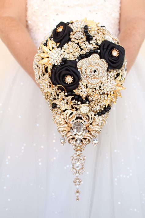 Dark wedding bouquet. Cascade  gold and black Wedding bouquet of brooches.  Bridal brooch bouquet. Teardrop wedding bouquet Unique wedding flowers. Perfect for destination wedding, Great Gatsby, Gothic wedding theme Prices for bridal bouquets depend on the size you choose. Measurements are made by the backside not across the top. Bouquet on the picture is 7" *11" size Matching accessories such as corsages, boutonnieres and bridesmaids bouquets can be made for you Flowers For Black And Gold Wedding, Dark Wedding Bouquet, Wedding Bouquet Cascade, Black Wedding Bouquet, Wedding Bouquet Unique, Gold And Black Wedding, Bouquet Cascade, Gold Wedding Bouquets, Bouquet Unique