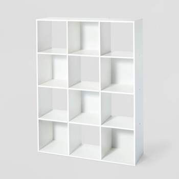 Give your traditional bookshelf a modern update with the 9 Cube Organizer Shelf from Room Essentials™. The shelf has a particleboard frame and has 9 cubes that give you sufficient storage space to keep books and decor items. The cubes are big enough to hold fabric storage bins too. You can use the top surface to keep plants or a key tray. The storage shelves have enclosed and open cubbies that you can fill in a variety of different ways, add the colored fabric boxes and now there is a colorful d Bins For Cube Organizer, House Basement, Cube Shelf, Dorm Furniture, Chicago Apartment, Apple Dessert, Organizer Shelf, Shelf White, Bookshelf Storage