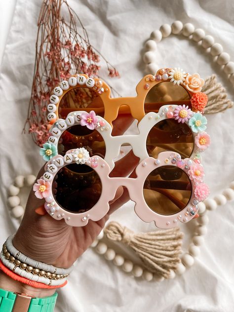 These Sunnies are what boho dreams are made of... dainty florals and extra sparkle and shine make these sunglasses truly one of a kind. You choose the color and the name/saying and I do the rest! You can also specify main colors you want or don't want in the design. Beaded Sunglasses Diy, Personalised Sunglasses, Cozy Hobbies, Christmas Sunglasses, Hippie Birthday Party, Diy Sunglasses, 11 Birthday, Navy Birthday, Scout Swaps