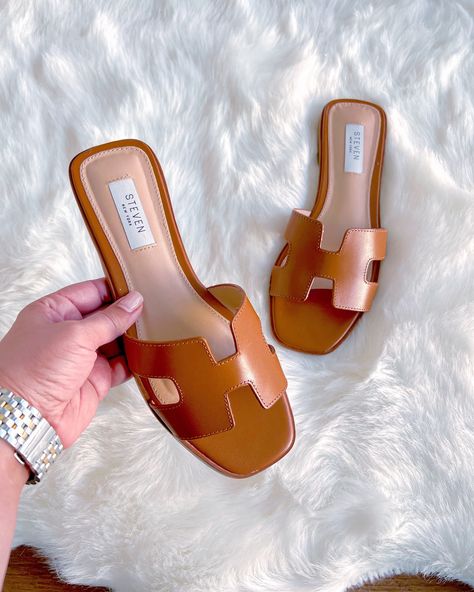 Click on the photo to shop! | Summer sandals, spring sandals, spring shoes, spring footwear, summer sandals, summer shoes, summer footwear, shoe wishlist, summer slides, flat sandals, spring slides, brown sandals, brown slides, cognac sandals, cognac slides, designer lookalike, designer inspired sandals, flip flops, cute sandals for summer, steve madden sandals, summer slides, neutral sandals, versatile sandals, summer outfits with sandals, women's style, fashion inspo Outfits With Sandals, Spring Slides, Cute Sandals For Summer, Casual Date Night Outfit Summer, Wishlist Summer, Dinner Outfits Summer, Spring Footwear, Brown Slides, Slide Sandals Outfit