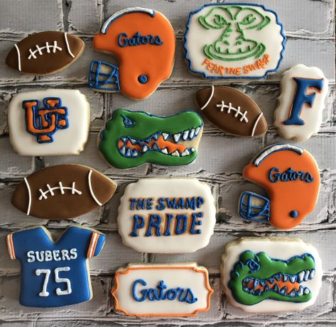 Custom UF Gator themed cookies    To see my other work or for more info on how to order, please visit my page or website  www.facebook.com/busybeecakery    www.busybeecakery.com    Email: malinda@busybeecakery.com Florida Gator Cookies Decorated, Florida Gators Cookies, Florida Gator Cookies, Gator Cookies, Gator Party, Uf Gator, Gator Football, Royal Icing Cookies Recipe, Cookie Gram