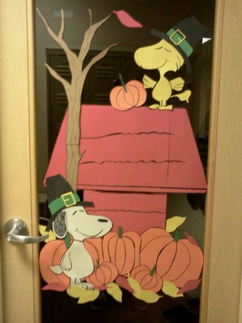 I made this for Thanksgiving for my office door.  Just construction paper and card board for the tree.  Planning on doing a christmas theme with it in december. Charlie Brown Thanksgiving Door Decorations, Autumn Theme Classroom Door, Peanuts Thanksgiving Classroom Door, Snoopy Thanksgiving Classroom Door, Door Decorating Thanksgiving, Thanksgiving Doors For School, Thanksgiving Decorations Door Classroom, Thanksgiving Teacher Door, Thanksgiving Doors For Preschool