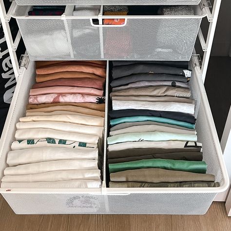 4 Genius Folding Techniques We're Stealing From Our Favorite Organizers — The Spruce Folding Shorts In Drawers, Fold Shorts In Drawers, Folded Clothes Organization Shelves, Keep Clothes Smelling Fresh Drawers, Home Edit Laundry Room Organization, Packing A Suitcase, Folding Tips, Folding Techniques, Professional Organizers