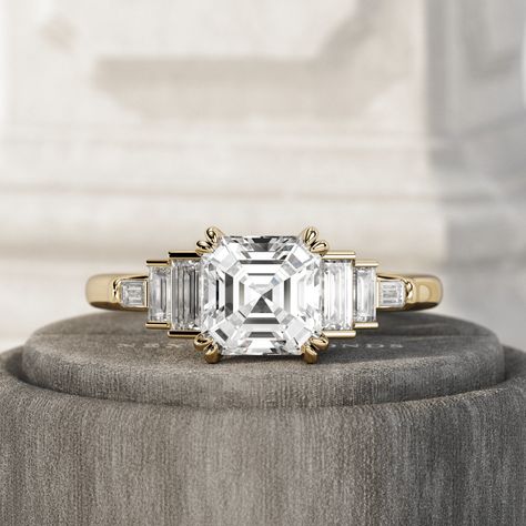 A beautiful 2 carat asscher cut & baguette lab diamonds engagement ring Setting : Ring Width  - 1.6mm Metal - Solid 14k \ 18k Gold / Platinum Gold Colors - Rose / Yellow / White Center Stone : Stone - Lab Grown Diamond Carat Weight - 2 Carat Shape - Asscher Color - F+ Clarity - VS1+ Polish/Symmetry - Ex/Ex Fluorescence - None Certificate - IGI / GIA Side Stones : Stones - Lab Grown Diamonds Total Carat Weight - 0.5 Carat Shape - Baguette Color - F+ Clarity - VS+ The carat weight is approximate and may vary slightly. Notes : + Every jewel comes with a professional Certificate of Authenticity/Appraisal. + We offer free international insured express shipping. + We offer a hassle-free 30-day return (100% refund). + We offer free engraving service (where applicable). + Complimentary gift wrappi Asscher 3 Stone Engagement Ring, Asscher Ring, Asscher Cut Engagement Ring, Asscher Cut Diamond Ring, Asscher Engagement Ring, Asscher Cut Engagement Rings, Victorian Engagement Rings, Ring Baguette, Rings Style