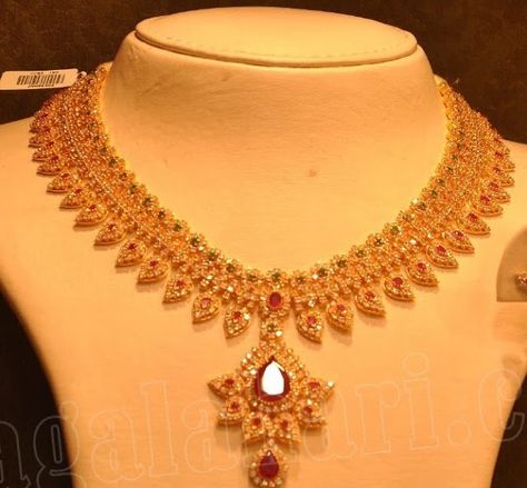 Beautiful uncut diamond necklace with leaf pattern, studded with rubies and emeralds by Malabar gold and diamonds. Malabar Gold Jewellery, Uncut Diamond Necklace, Gold Bridal Necklace, Choker Necklace Designs, Gold Necklace Indian, Beautiful Gold Necklaces, Pearl Necklace Designs, Gold Necklace Indian Bridal Jewelry, Antique Bridal Jewelry