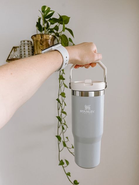 Holding a Stanley Mug THE ICEFLOW FLIP STRAW TUMBLER | 30 OZ with aesthetic shelf and pothos plant in the background Stanley Mug Aesthetic, Stanley Ice Flow Tumbler, Stanley Cup Iceflow, Stanley Iceflow Aesthetic, Stanley Water Bottle Aesthetic, Stanley Cup Tumbler, Stanley Flip Straw Tumbler, Stanley Tumbler Aesthetic, Stanley Cup Aesthetic