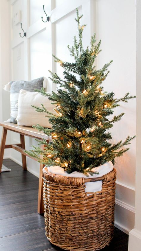 Small Christmas Tree Living Room, Christmas Over Cabinet Decor, Non Tacky Christmas Decor, Christmas Tree In Basket With Blanket, Christmas Trees In A Basket, Christmas Present Under Tree, Scandi Christmas Tree Ideas, Christmas Tree In A Basket Diy, Christmas Built In Decor