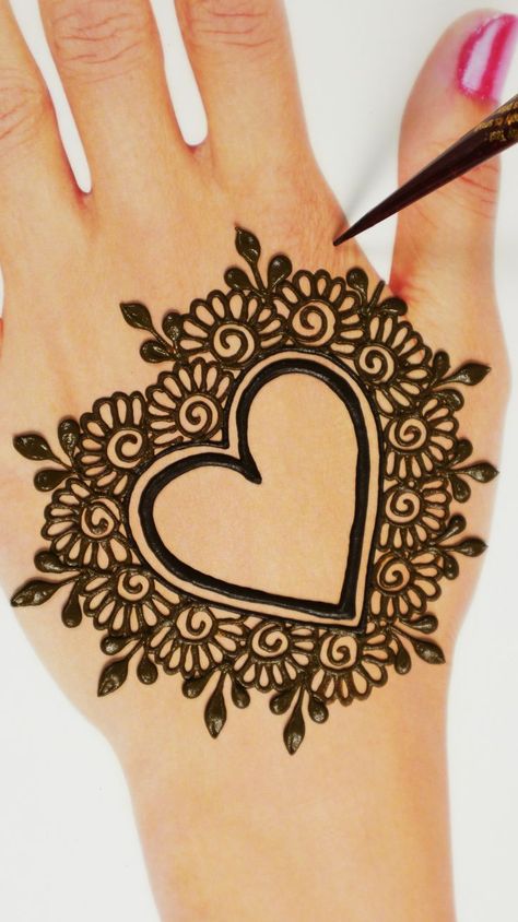 New style heart shape arabic mehndi design for back side hands. Must apply on your hands in karwachauth. #arabicmehndi #karwachautmehndi #mehndidesign #mehandi #backhandmehndi Heart Mehndi Designs, Heart Mehndi, Simple Henna Designs Hand, Hena Designs, Latest Mehndi Design, Arabic Mehndi Design, Henna Art Designs, Hand Heart, Very Simple Mehndi Designs